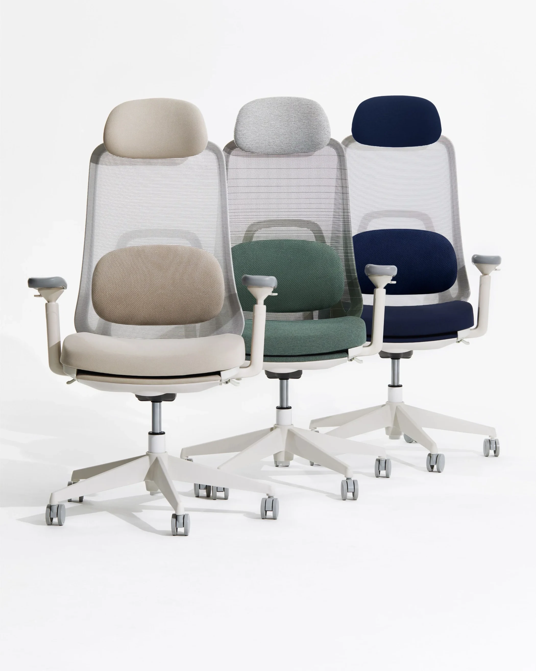 Three TopJob VOYA Ergonomic Chairs in light, green and navy finishes